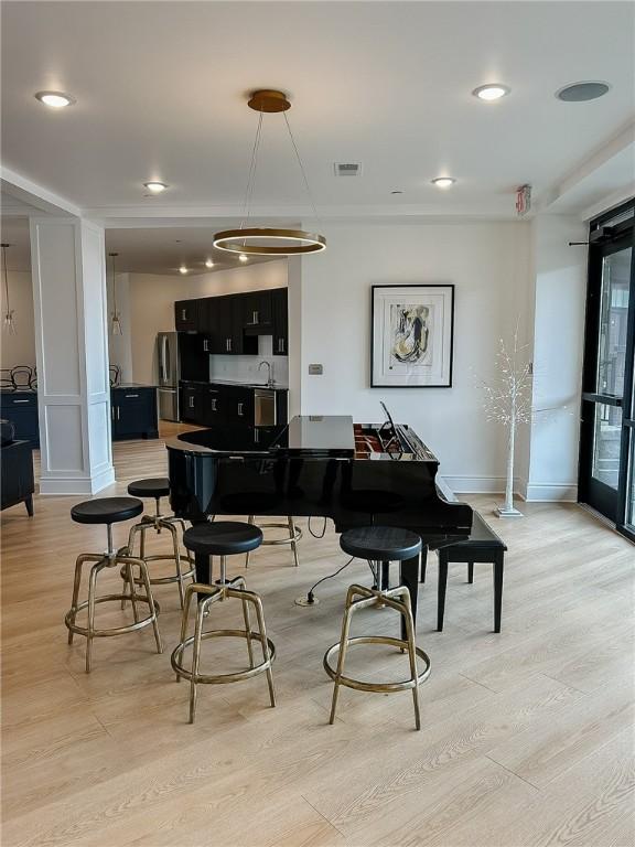 1 1st St Unit 413, Oakmont, PA 15139 - dining space with baseboards, visible vents, and light wood-style floors