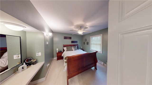 bedroom featuring baseboards, a ceiling fan, light colored carpet, and a baseboard radiator
