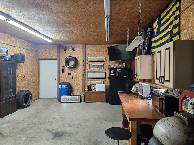 office space featuring unfinished concrete flooring