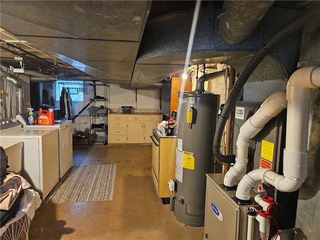basement featuring gas water heater and independent washer and dryer