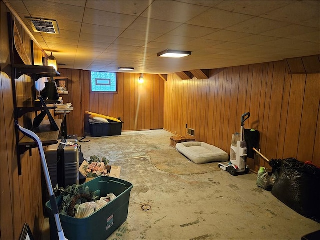 below grade area featuring wood walls