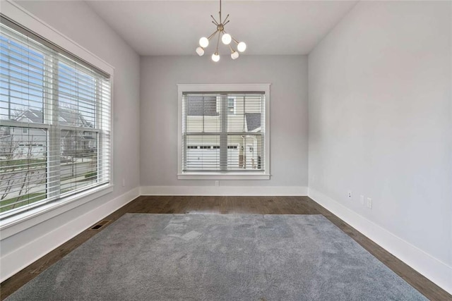 671 Chilliwack Ln, Marshall, PA 16046 - spare room featuring dark carpet, baseboards, an inviting chandelier, and visible vents