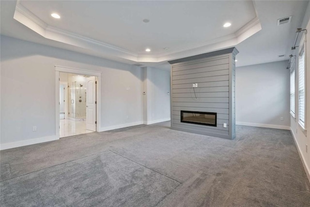 671 Chilliwack Ln, Marshall, PA 16046 - unfurnished living room featuring crown molding, a large fireplace, visible vents, carpet floors, and a raised ceiling
