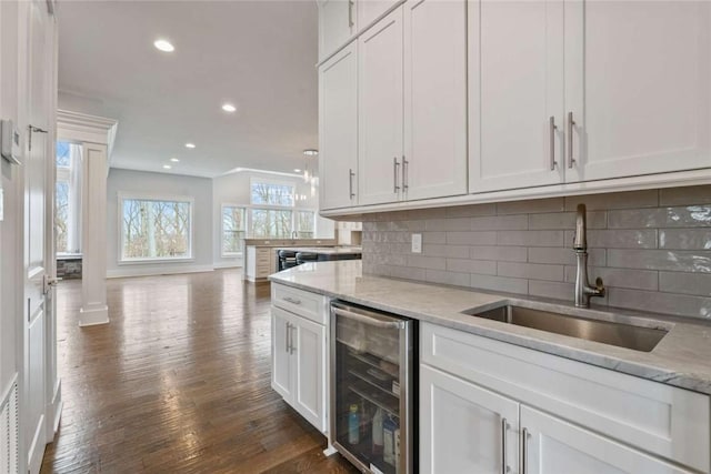 671 Chilliwack Ln, Marshall, PA 16046 - bar with recessed lighting, dark wood-style flooring, a sink, wine cooler, and decorative backsplash