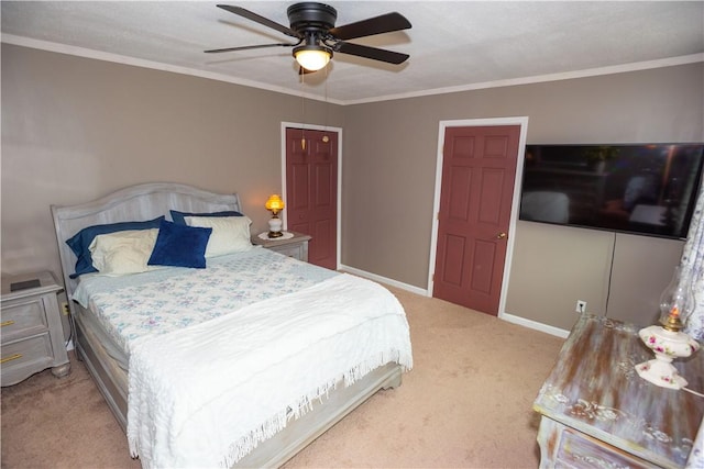 bedroom with light colored carpet, ornamental molding, ceiling fan, and baseboards