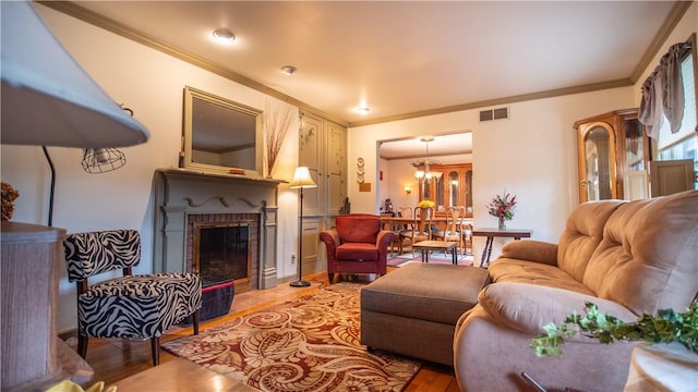 612 Freeport Rd, South Buffalo Twp, PA 16229 - living area featuring ornamental molding, light wood-style flooring, and a fireplace