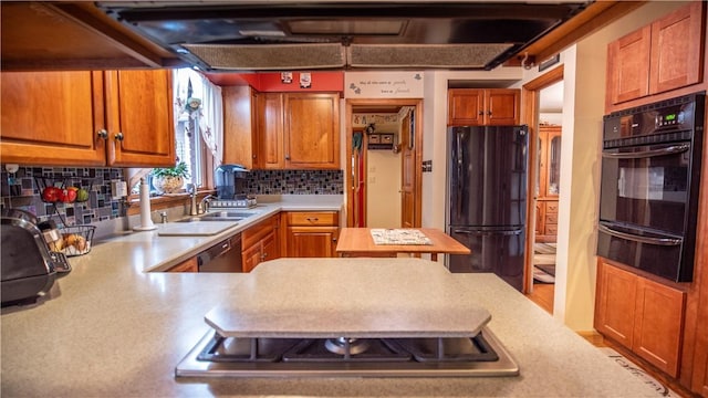612 Freeport Rd, South Buffalo Twp, PA 16229 - kitchen with black appliances, a warming drawer, light countertops, a sink, and tasteful backsplash