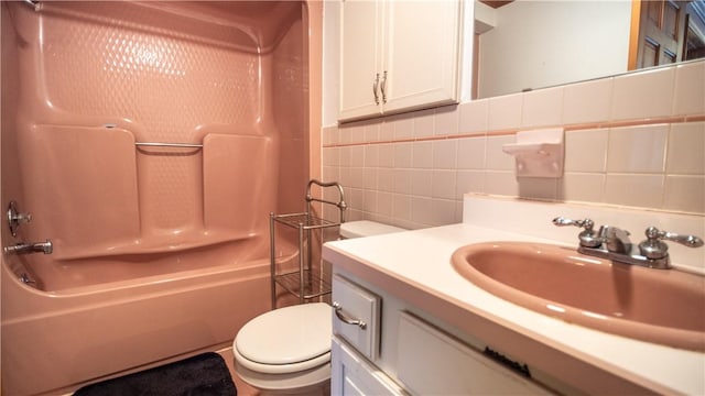 612 Freeport Rd, South Buffalo Twp, PA 16229 - bathroom featuring toilet, vanity, shower / bath combination, tile walls, and decorative backsplash
