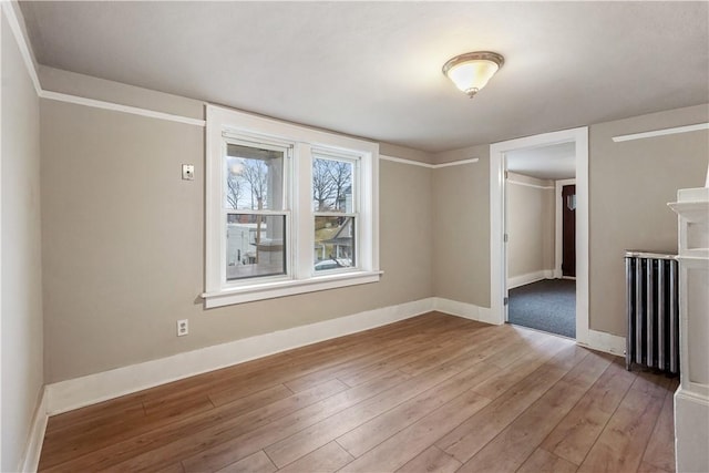 528 3rd St, Charleroi Boro, PA 15022 - unfurnished room with baseboards, light wood-style flooring, and radiator heating unit