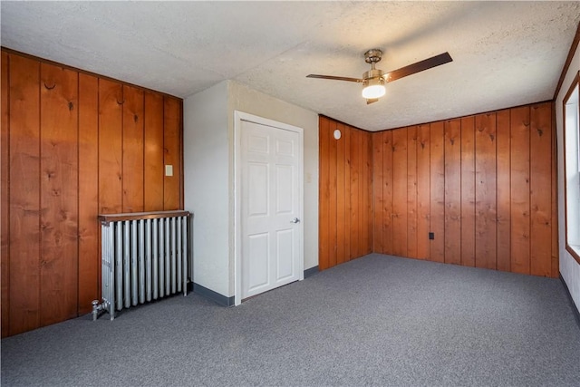 528 3rd St, Charleroi Boro, PA 15022 - carpeted spare room featuring a textured ceiling, ceiling fan, and wooden walls