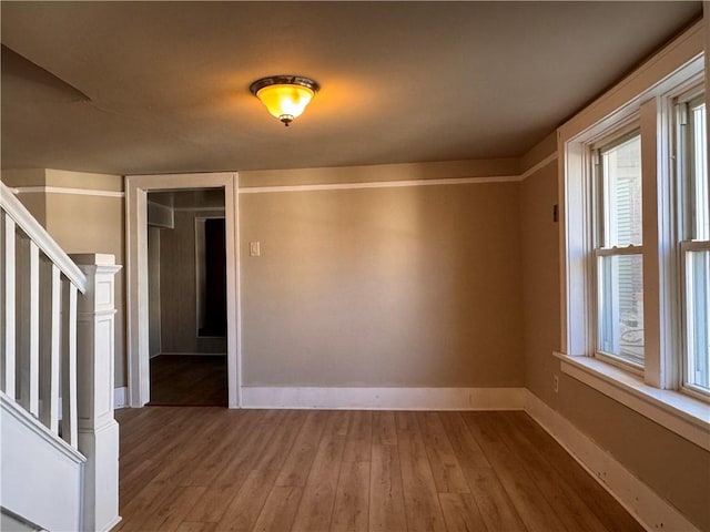 528 3rd St, Charleroi Boro, PA 15022 - empty room featuring wood-type flooring, baseboards, and stairs