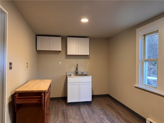 528 3rd St, Charleroi Boro, PA 15022 - kitchen featuring white cabinets, a sink, dark wood-style flooring, and baseboards