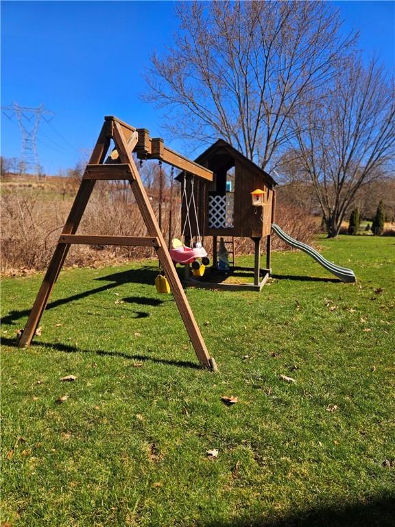 view of playground featuring a lawn