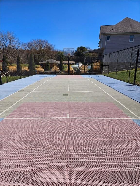 view of sport court featuring fence and community basketball court