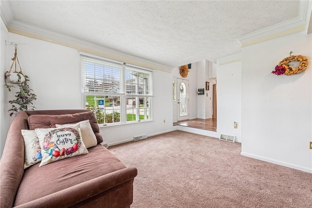 living area with crown molding, carpet flooring, and visible vents