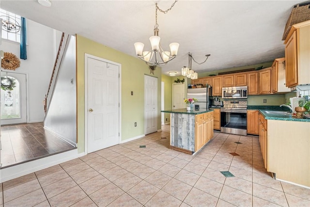 114 Adella Ct, Penn Twp Wml, PA 15644 - kitchen featuring stainless steel appliances, a chandelier, a center island, and dark countertops