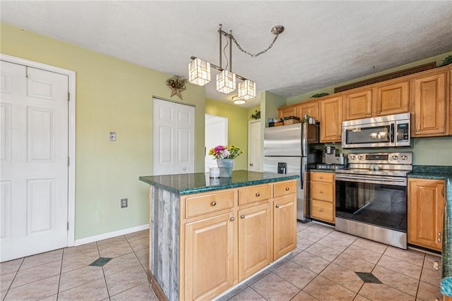 kitchen with a chandelier, light tile patterned floors, a kitchen island, decorative light fixtures, and appliances with stainless steel finishes