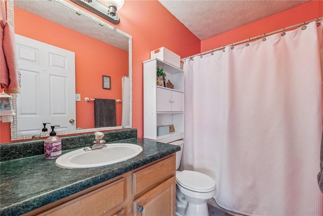 bathroom with a shower with shower curtain, vanity, a textured ceiling, and toilet