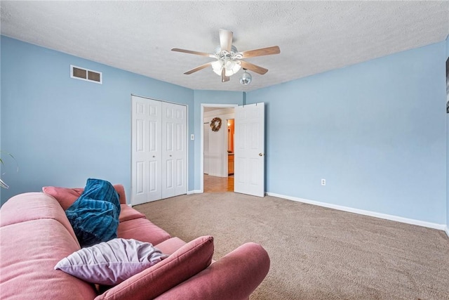 114 Adella Ct, Penn Twp Wml, PA 15644 - carpeted living area with ceiling fan, baseboards, and a textured ceiling