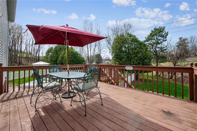 wooden terrace with outdoor dining space