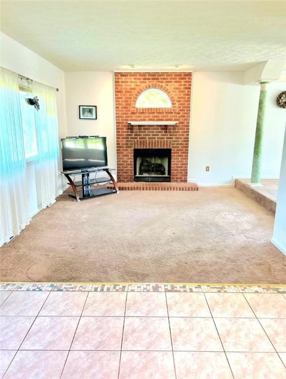 114 Adella Ct, Penn Twp Wml, PA 15644 - unfurnished living room featuring carpet flooring, a fireplace, and tile patterned floors