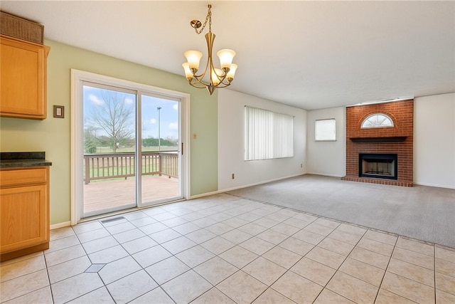 114 Adella Ct, Penn Twp Wml, PA 15644 - unfurnished living room featuring a chandelier, a brick fireplace, light carpet, baseboards, and light tile patterned floors