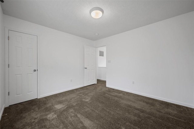 1768 Haflinger Dr, North Huntingdon, PA 15642 - unfurnished bedroom featuring baseboards, visible vents, and dark colored carpet