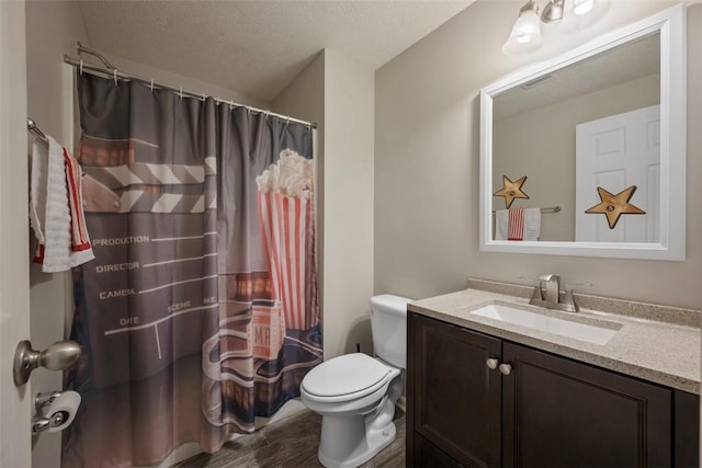 1768 Haflinger Dr, North Huntingdon, PA 15642 - full bath featuring vanity, toilet, a textured ceiling, wood finished floors, and visible vents