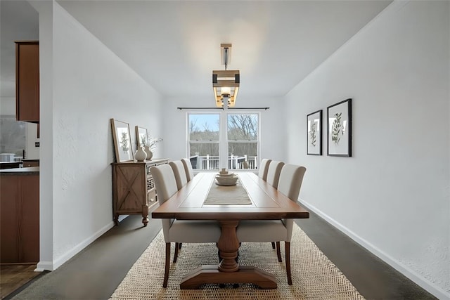 1768 Haflinger Dr, North Huntingdon, PA 15642 - dining space with baseboards and a chandelier