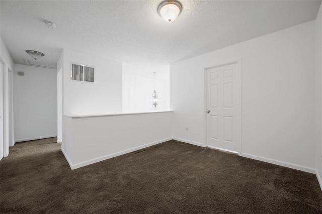 1768 Haflinger Dr, North Huntingdon, PA 15642 - spare room featuring baseboards, attic access, dark colored carpet, and visible vents