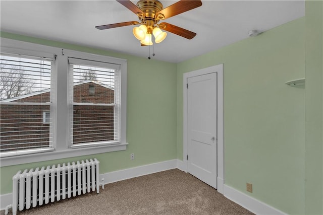115 Powell St, Wilkins Twp, PA 15112 - carpeted empty room with radiator, baseboards, and ceiling fan