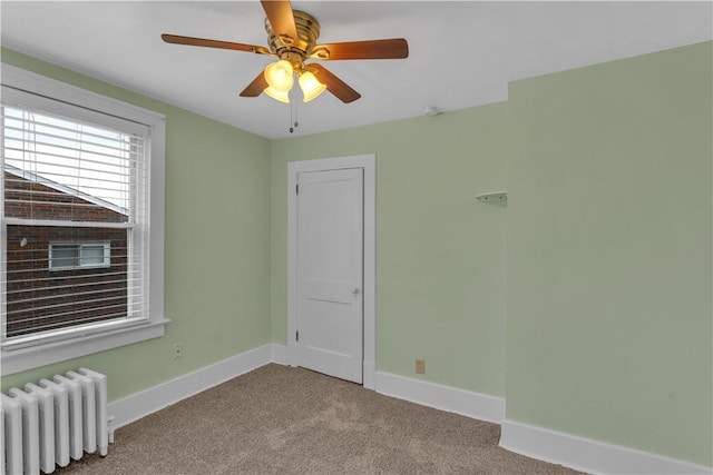 115 Powell St, Wilkins Twp, PA 15112 - spare room with radiator, carpet floors, baseboards, and a ceiling fan