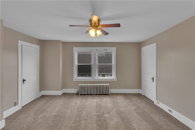 115 Powell St, Wilkins Twp, PA 15112 - carpeted spare room featuring radiator heating unit, ceiling fan, and baseboards