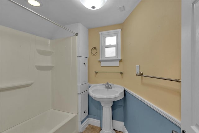 115 Powell St, Wilkins Twp, PA 15112 - full bathroom with baseboards, shower / bath combination, and a sink