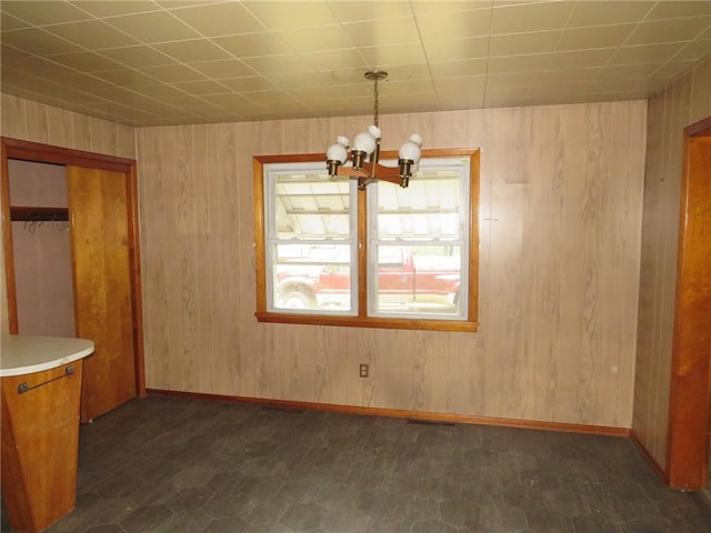 413 S 5th St, West Newton, PA 15089 - unfurnished dining area with a chandelier and wooden walls