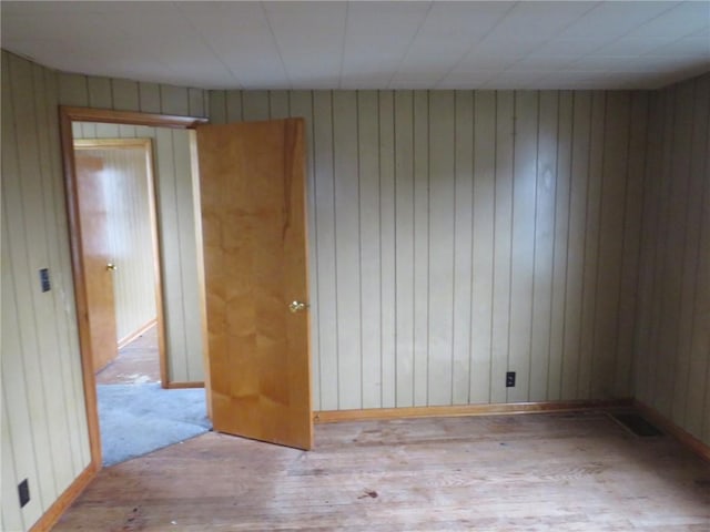 413 S 5th St, West Newton, PA 15089 - spare room featuring hardwood / wood-style flooring and wood walls