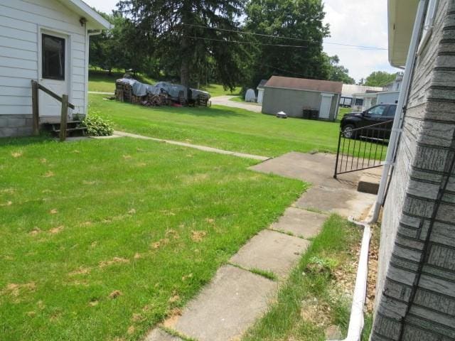 413 S 5th St, West Newton, PA 15089 - view of grassy yard with an outbuilding