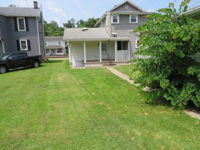 413 S 5th St, West Newton, PA 15089 - back of property featuring a lawn and a porch