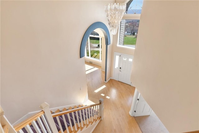 2036 Revere Dr, Connellsville, PA 15425 - entryway with plenty of natural light, wood finished floors, a chandelier, and a towering ceiling