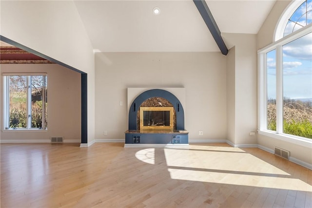 2036 Revere Dr, Connellsville, PA 15425 - unfurnished living room with a glass covered fireplace, high vaulted ceiling, and wood finished floors