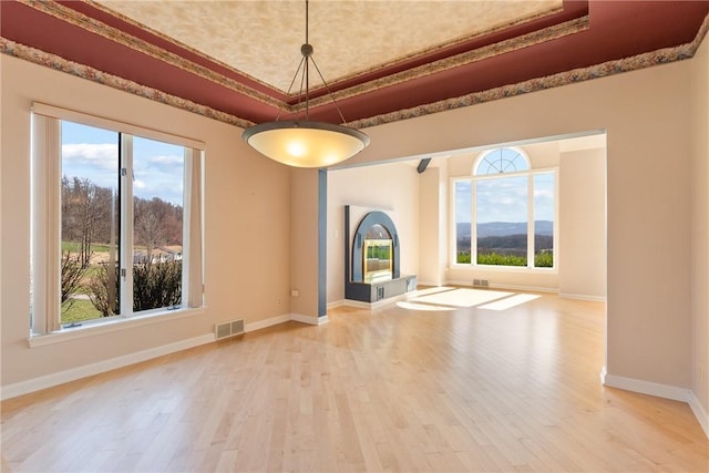 2036 Revere Dr, Connellsville, PA 15425 - unfurnished living room featuring a raised ceiling and light wood finished floors