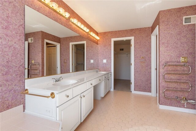 2036 Revere Dr, Connellsville, PA 15425 - bathroom with vanity and a walk in closet