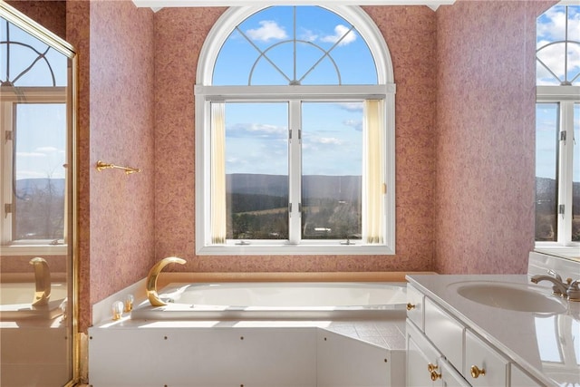 2036 Revere Dr, Connellsville, PA 15425 - full bath featuring wallpapered walls, vanity, healthy amount of natural light, and a garden tub