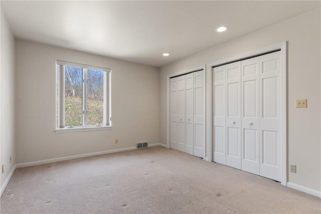 2036 Revere Dr, Connellsville, PA 15425 - unfurnished bedroom featuring multiple closets, carpet flooring, and recessed lighting