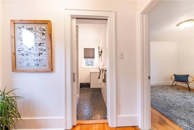 hall with light wood-type flooring