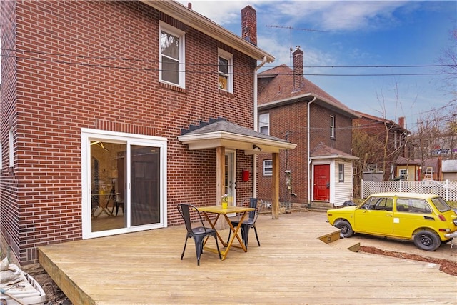 wooden deck with an outdoor structure