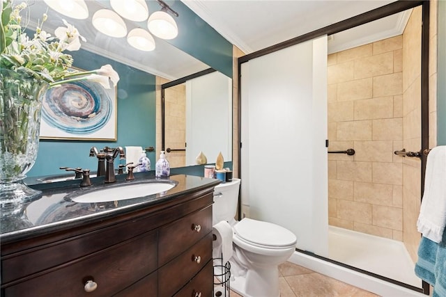 bathroom with crown molding, toilet, vanity, a stall shower, and tile patterned flooring