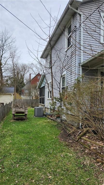 613 Terrace Ave, Grove City Boro, PA 16127 - exterior space with cooling unit, fence, and a lawn