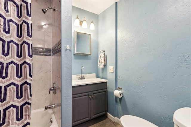 bathroom with tile patterned floors, shower / bath combo with shower curtain, vanity, and toilet
