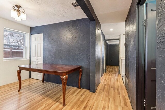 808 Thompson Run Rd, Springdale Twp, PA 15049 - corridor featuring light wood-style flooring and a textured wall